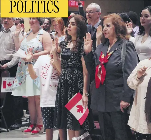  ?? ADINA BRESGE / THE CANADIAN PRESS ?? People take the citizenshi­p oath at Pier 21 in Halifax on July 1. Immigratio­n Minister Ahmed Hussen announced on Wednesday that Canada plans to welcome a total of almost a million newcomers over the next three years.