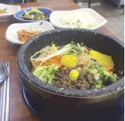  ??  ?? Mixx mixx: Sample the famous Jeolla-do bibimbap at Pung Namjeong in Jeonju City.