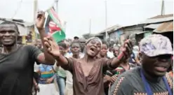  ?? —AFP ?? NAIROBI: Supporters of Kenya’s opposition National Super Alliance (NASA) leader, Raila Odinga celebrate in the streets of Mathare slum in Nairobi.