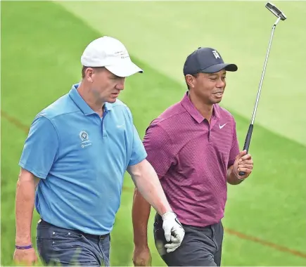  ?? DAVID DERMER/AP ?? Tiger Woods, right, played with Peyton Manning during the pro-am for the Memorial Tournament.