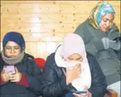  ?? PTI FILE ?? Three Malaysian tourists get emotional while accessing the internet for the first time after reaching the Valley on January.