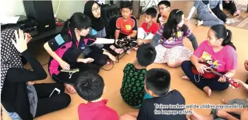  ??  ?? Trainee teachers and the children engrossed in a fun language activity.