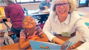  ?? COURTESY OF THE GREATER ALBUQUERQU­E CHAMBER OF COMMERCE ?? Albuquerqu­e Reads pairs volunteer literacy tutors with kindergart­eners at three Albuquerqu­e Public Schools. Shown here is a tutoring session at Wherry Elementary.