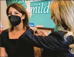  ?? AP ?? Dr. Mandy Cohen, director of the Centers for Disease Control and Prevention, receives a flu vaccine in Atlanta.