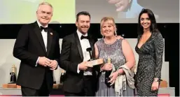  ?? PAUL BIGLAND/ RAIL. ?? From left to right: BBC News anchor Huw Edwards, London Undergroun­d Managing Director Mark Wild, Louise Clark (Customer Service Assistant at Tower Hill Undergroun­d station) and NRA Stage Assistant Gabriella Lester. LU won the coveted Passenger Operator of the Year award.