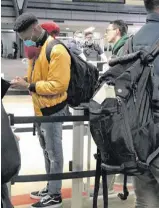  ?? FRAM DINSHAW/TRURO NEWS ?? Facemasks were in vogue at Ottawa’s Macdonald-cartier Internatio­nal Airport. The last flight from London landed at 1:30 a.m. on March 17, about 11 hours late.