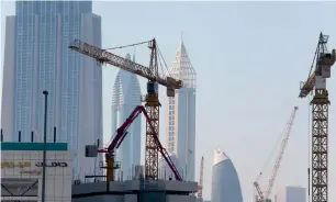  ??  ?? Dubai’s regulators are striving to ensure developers’ ability for on-time project delivery.