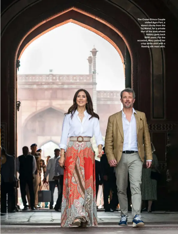  ?? ?? The Crown Prince Couple visited Agra Fort, a stone’s throw from the Taj Mahal, for a private tour of the area whose history goes back 1000 years. For the occasion, Mary paired her crisp white shirt with a flowing silk maxi skirt.