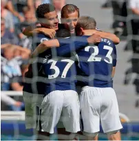  ??  ?? Tottenham Hotspur’s Dele Alli (left) celebrates his goal with team mates in their Premier League match against Newcastle United at St James’ Park on Sunday. Tottenham won 2-0. —