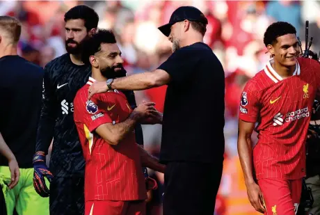  ?? Reuters ?? Liverpool manager Juergen Klopp embraces Mohamed Salah after his last Premier League match as Liverpool manager against Wolverhamp­ton.