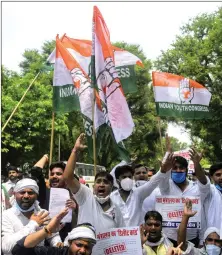  ?? ANI ?? Members of Indian Youth Congress shout slogans outside Defence Minister Rajnath Singh’s residence, in New Delhi on Friday.