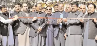  ??  ?? ISLAMABAD
Federal Minister for Railways Azam Swati and Chairman Senate Sadiq Sanjrani cutting ribbon to inaugurate Safari Tourist Train at Golra Railway Station. -APP