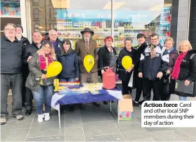  ??  ?? Action force Carol and other local SNP members during their day of action