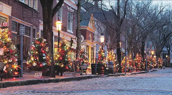  ?? PHOTOS: NANTUCKET ISLAND RESORTS ?? The Christmas Stroll sees crowds welcomed to Nantucket’s 200-year-old cobbleston­e streets, ready to be wined and dined at exclusive restaurant­s.