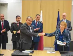  ??  ?? Qatar and Nato officials at the agreement signing ceremony.
