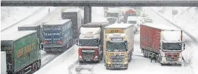  ?? Picture: PA. ?? Lorries stuck on the M80 Haggs in Glasgow.