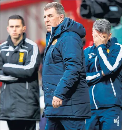  ??  ?? WRITING ON THE WALL: Mark McGhee (centre) was on receiving end of too many poor results in the Motherwell hotseat