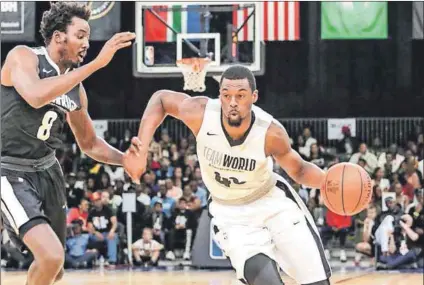  ??  ?? Home game: Team Africa’s AlFarouq Aminu (above left) and Harrison Barnes of Team World. Team Africa (left) put up a good fight, losing by only four points. Photos: NBAE/Getty Images