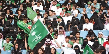  ??  ?? Saudi families sit in a stadium to attend an event in Riyadh on Saturday commemorat­ing Kingdom’s 87th National Day. (AFP)