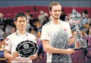  ?? REUTERS ?? Daniil Medvedev (R) with the trophy alongside Kei Nishikori.