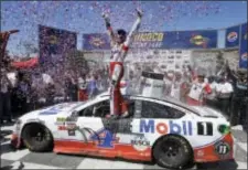  ?? THE ASSOCIATED PRESS ?? Kevin Harvick celebrates Sprint Cup Series race. after winning Sunday’s NASCAR