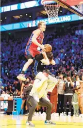  ?? TIM NWACHUKWU GETTY IMAGES ?? 76ers two-way player Mac Mcclung, dunking in the first round, wins the dunk contest at Vivint Arena.