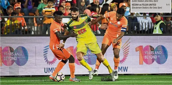  ?? — Bernama ?? You will be missed: Kedah midfielder Liridon Krasniqi (centre) will miss the second leg of the Malaysia Cup semi-finals against Felda United in Alor Setar today due to suspension.