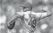  ??  ?? Cardinals relief pitcher Jordan Hicks delivers against the Giants on Saturday in San Francisco. Hicks leads the majors with 286 pitches reaching triple-digit speed JOHN HEFTI/USA TODAY SPORTS