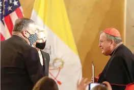  ?? AP Photo/Andrew Medichini ?? ■ U.S. Secretary of State Mike Pompeo, left, and U.S. Ambassador to the Holy See Callista Gingrich greet Cardinal Raymond Burke, right, as they attend the “Advancing and Defending Internatio­nal Religious Freedom Through Diplomacy” symposium Wednesday in Rome.