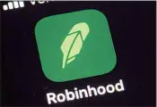  ?? ?? This Dec. 17, 2020, photo shows the logo for the Robinhood app on a smartphone in New York. The CEO of cryptocurr­ency exchange FTX has bought a significan­t, 7.6% stake in Robinhood Markets, according to a filing with U.S. regulators on Thursday, May 12, 2022. (AP)