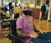  ?? LEONARD ORTIZ — ORANGE COUNTY REGISTER ?? Hairstylis­t Courtney Leavitt, 34, at his station at Shorty’s Barber Shop in Los Angeles, says he freely talks politics with clients but not in an effort to influence their vote.