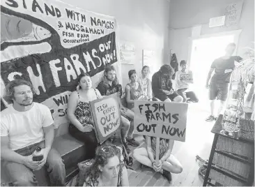  ??  ?? Indigenous-rights, environmen­tal and social-justice activists staged sit-ins in September to protest fish farms, including in Agricultur­e Minister Lana Popham’s constituen­cy office.
