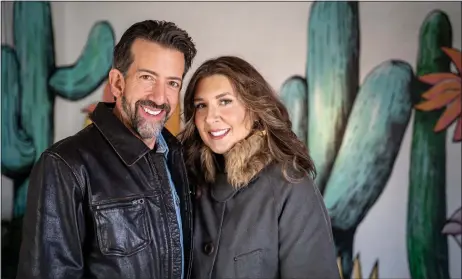  ?? NATHAN BURTON/Taos News ?? Jody and Xochitl Wodrich, owners of the new Desert Flower hotel, stand for a portrait Friday (Dec. 23).