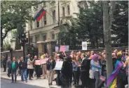  ?? Thomas Hornall / Associated Press ?? Protesters rally outside the Russian Embassy in London against the abuse of gays in Chechnya.