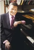  ?? CHRISTIAN STEINER/MARIA COOPER JANIS VIA AP ?? Byron Janis, renowned concert pianist and composer, poses next to a piano.