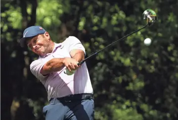  ?? PHOTOS BY ROB SCHUMACHER/THE REPUBLIC ?? Francesco Molinari hits his tee shot on the second hole during the third round of the Masters on Saturday at Augusta National Golf Club.