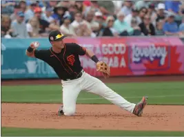  ?? JOHN MEDINA — FOR THE BAY AREA NEWS GROUP ?? Giants third baseman Shane Matheny makes a difficult play during a spring training game against the Royals at Scottsdale Stadium on Sunday in Scottsdale, Arizona.