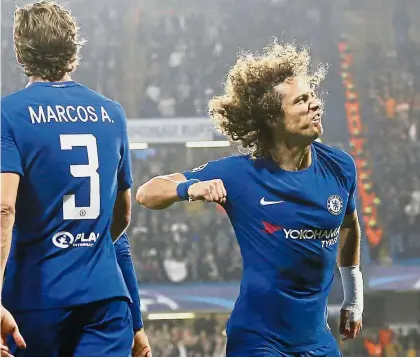  ?? — AP ?? We’re fighters: Chelsea’s David Luiz celebratin­g after scoring against AS Roma in the Champions League match at Stamford Bridge on Wednesday.