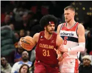  ?? NICK WASS — THE ASSOCIATED PRESS ?? Jarrett Allen dribbles the ball against Wizards center Kristaps Porzingis during the first half Feb. 6in