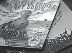  ??  ?? A copy of “The Little Engine that Could” from Dolly Parton’s Imaginatio­n Library sits on the table at Haley Allgood’s home.