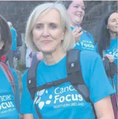  ??  ?? Stepping out: Helen during a Slieve Donard climb for Cancer Focus