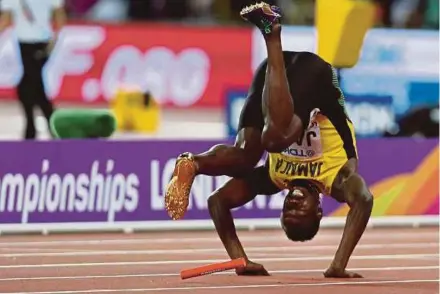  ?? AFP PIC ?? Jamaica’s Usain Bolt falls after suffering a hamstring injury during the 4x100m event at the World Championsh­ips on Saturday.