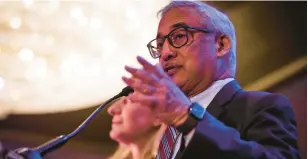  ?? JOHN C. CLARK/AP ?? Bobby Scott, a U.S. Rep. from Newport News, gets ready to introduce Congresswo­man-elect Jennifer McClellan at her election party Tuesday.