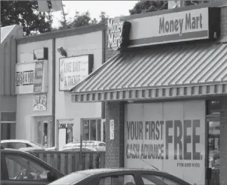  ?? JOHN RENNISON, THE HAMILTON SPECTATOR ?? There’s a Cash 4 You store on Upper James at Mohawk Road, next door to a Money Mart. And there’s another Money Mart right across the street.