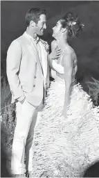  ?? Izak Rappaport via AP ?? n Bride Andi Potamkin weds Jordan Blackmore in an outdoor ceremony Nov. 7, 2015, at the Canyon Point, Utah, resort Amangiri. Potamkin wore a custom skirt and bra top designed by Maurizio Galante.
