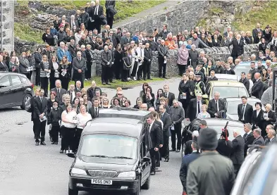  ?? Picture: PA. ?? Mourners follow the funeral procession of Eilidh MacLeod after the service in Castlebay on the island of Barra.