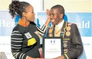  ??  ?? GOOD JOB: The Herald Matric of the Year Excellence Award winner Alungile Mto with The Herald editor Nwabisa Makunga