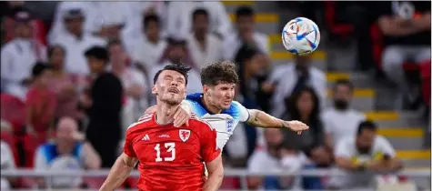  ?? ?? Ex-Reds: Former Barnsley players John Stones and Kieffer Moore in action during England’s 3-0 win over Wales on Tuesday.
Picture: Getty Images