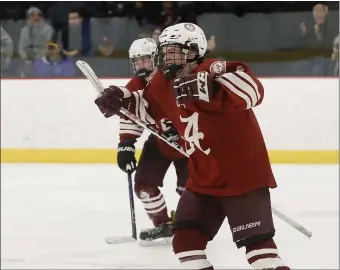  ?? PHOTO BY PAUL CONNORS — MEDIA NEWS GROUP/BOSTON HERALD ?? Arlington’s Evan Jones celebrates after scoring the game-winning goal against Woburn in overtime Saturday.