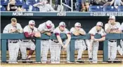  ?? NATI HARNIK/AP ?? Florida State players watch the ninth inning Wednesday as the Seminoles fell to LSU, ending their season.